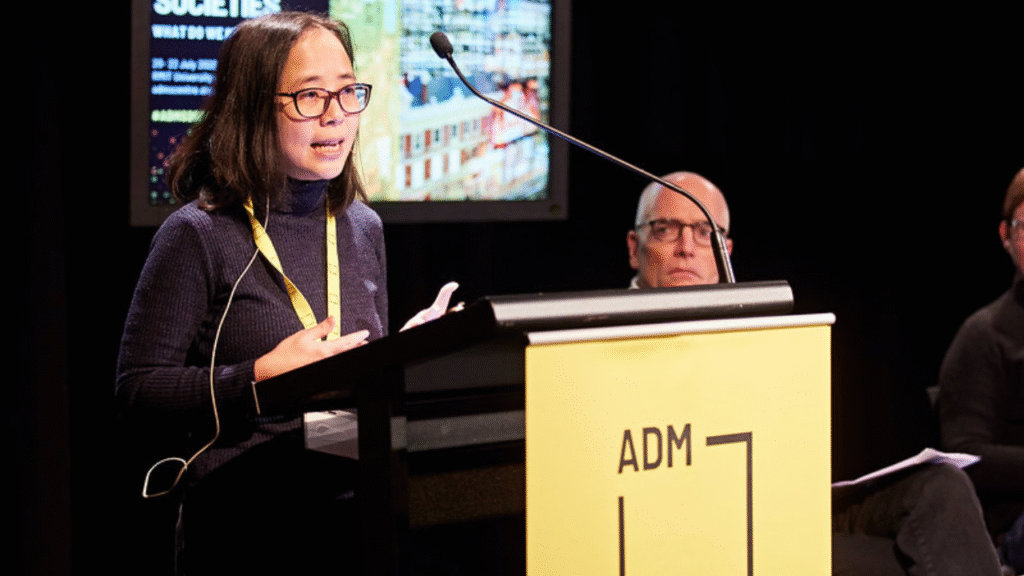 Speaker at lecturn at 2022 Symposium event